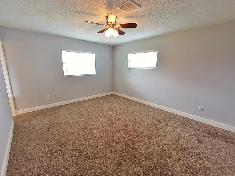 Master bedroom with ensuite bath (view 2)