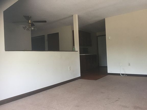 Living room with wall separation to eating area