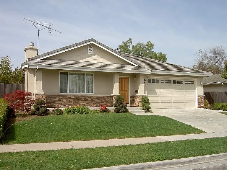 Front Yard - Situated on a serene street with zero through traffic for great peace and privacy. Spacious two-car garage.