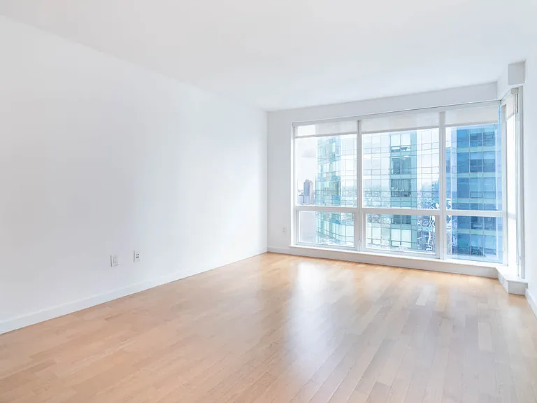 Living Room with Hard Surface Flooring and Floor to Ceiling Windows