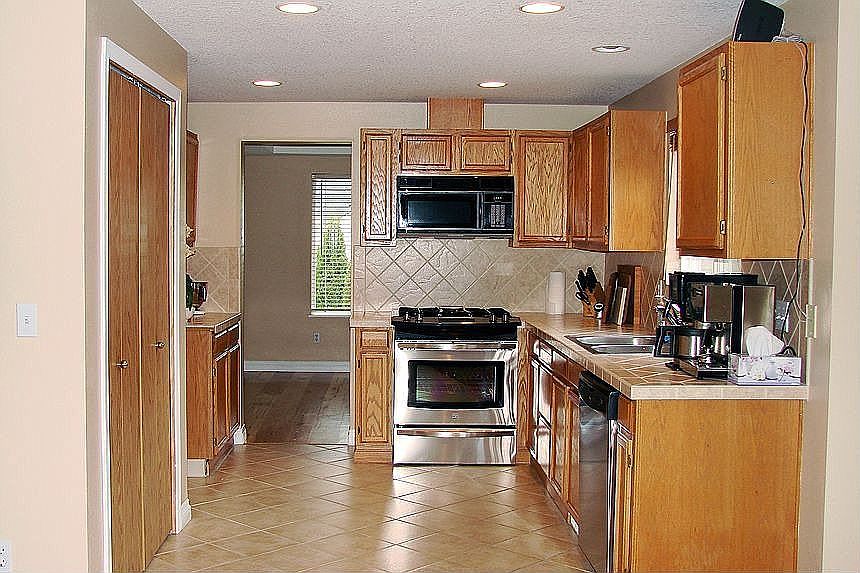 New Appliances in Tiled Kitchen