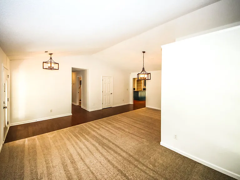 dining + living room area, front entry