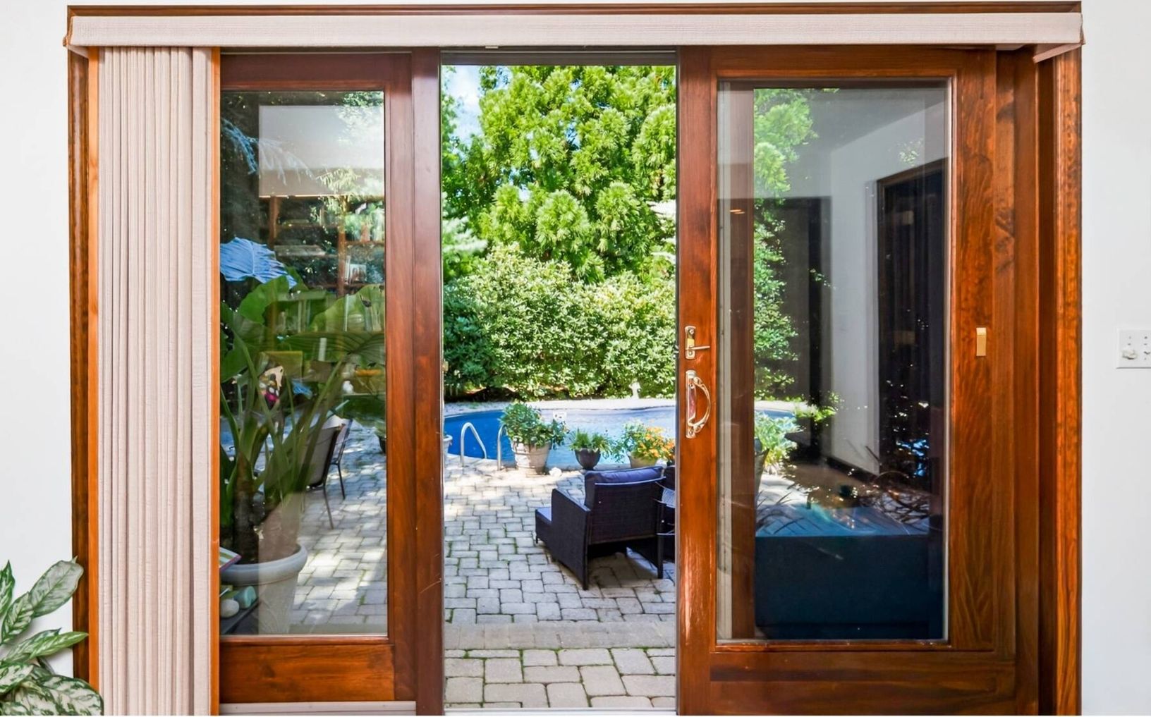  Glass doors lead to the pool and patio