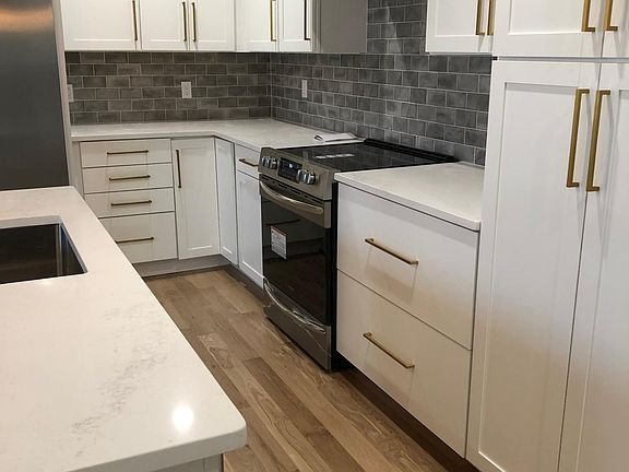 White Oak Floors throughout. Air Fryer Style Oven, with plenty of storage in cabinetry.