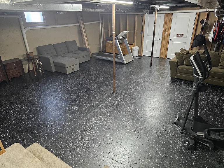 Basement living area with the 2 non conforming rooms/offices in the background