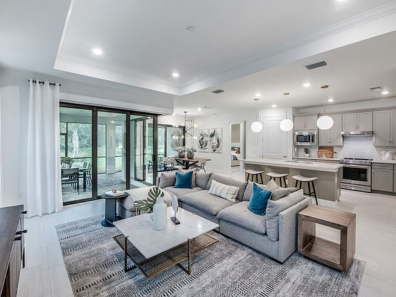 Connected kitchen, gathering and dining spaces