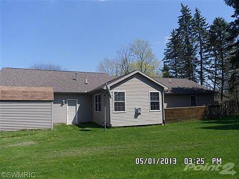 Rear of home with deck