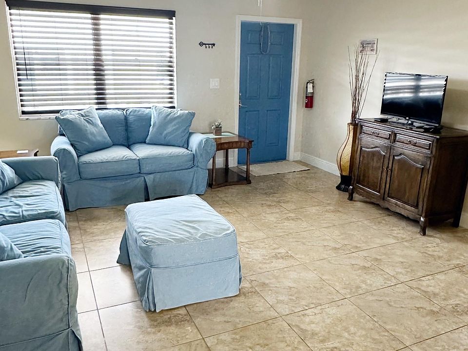 Full view of living room space and entertainment