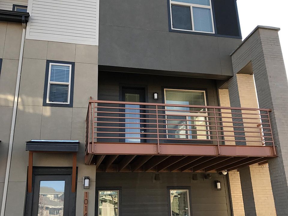 Modern three story town house facing west and on the south e