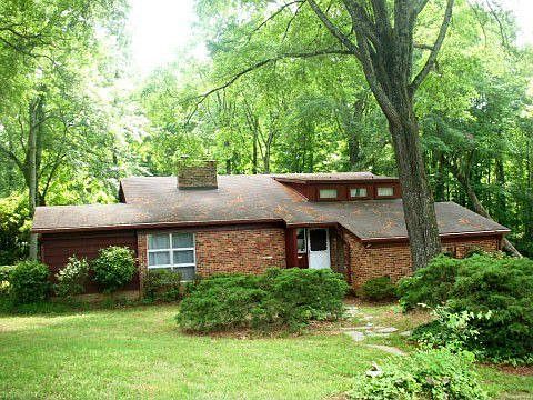 Beautiful and full of huge, old hardwoods on a 1.16 acre lot
