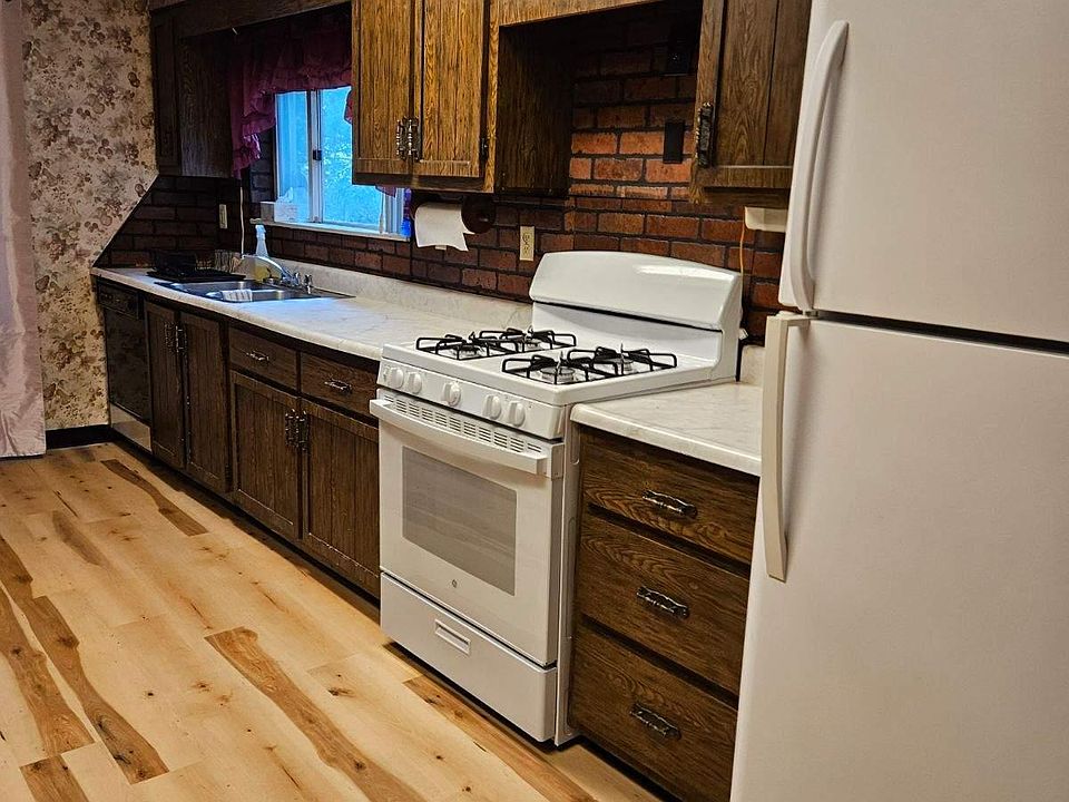kitchen with new stove and new flooring