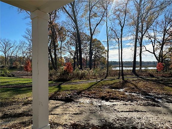 covered porch and backyard
