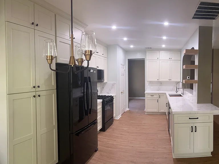 View of Kitchen from Breakfast Nook. Entrance at back leads to dining room for easy serving.