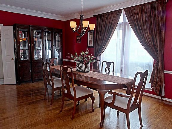 The size of this dining room allows you to selectively arrange your prized pieces in numerous ways. As you can see there is plenty of room for a large table, chairs, china cabinet and even room for more!