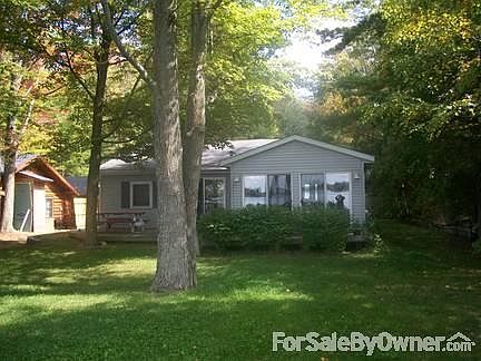 View from lake
						:
						Large trees provide shade. Front and back yards large enough for games.