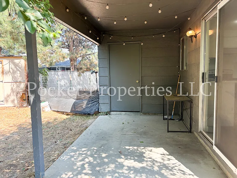 Backyard covered patio directly off of kitchen