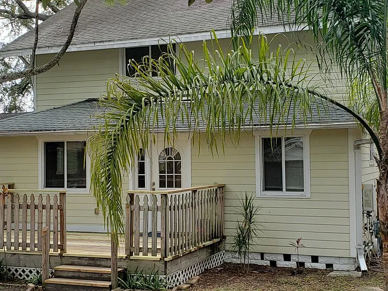 Walkway from ample parking in rear of home