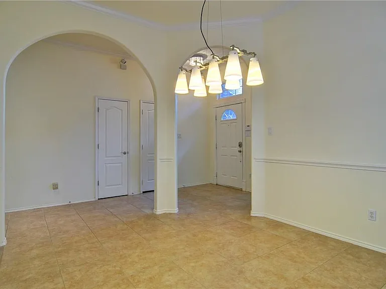 Doors lead to the garage & Coat closet