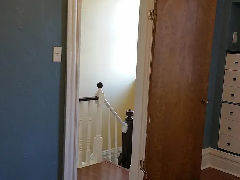 The smaller bedroom features hard floors and a small closet - the hall closet is very large and just outside the door.