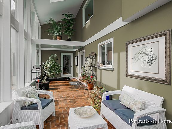 This room has been virtually painted to show this neutral shade. In reality, the room is painted a t