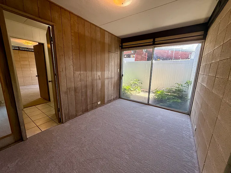 Bedroom 4 with access to shared patio