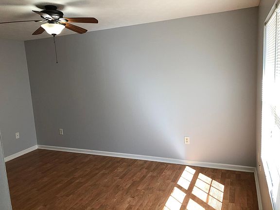 Walk in to living room with hardwood floors