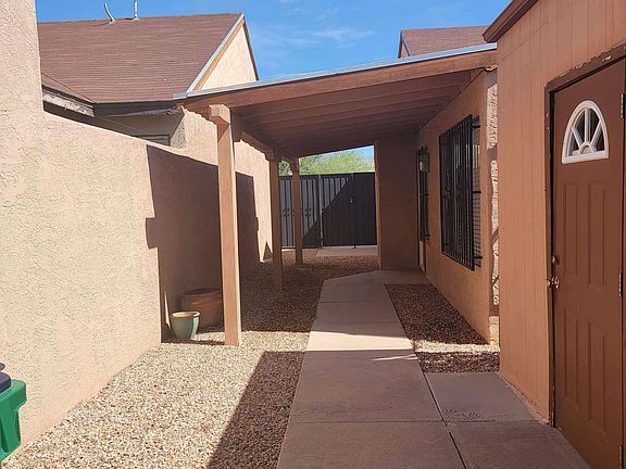 Private courtyard and entrance to the detached, enclosed 2-car garage.