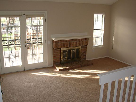 Wood burning fireplace in family room. Access to the deck and backyard.