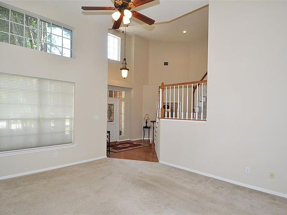 High ceilings in the formal living room showcase the signature windows of a Life Forms home.