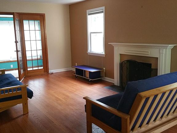 Large living room with wood burning fireplace