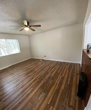 Main room with new ceiling fan, flooring