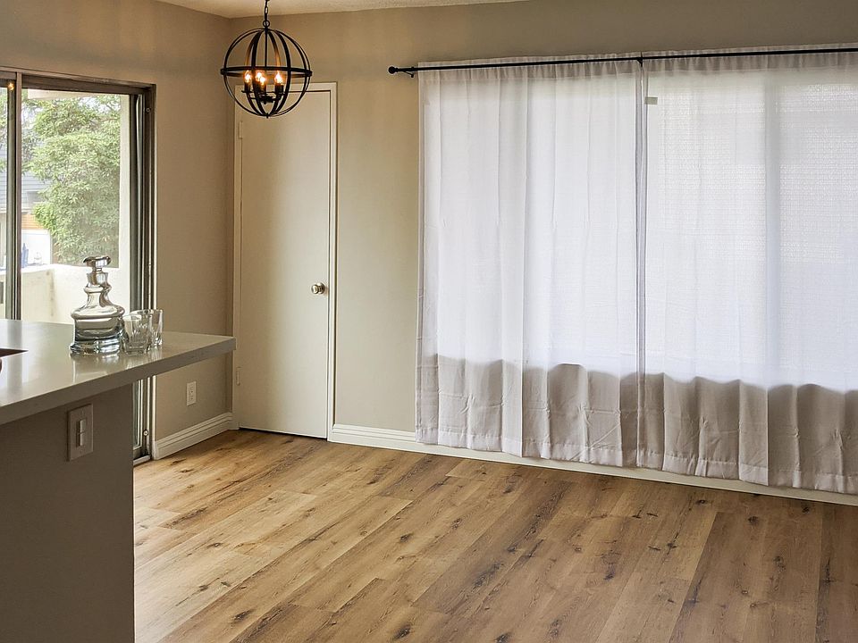 View of dining/living room with walk in storage closet
