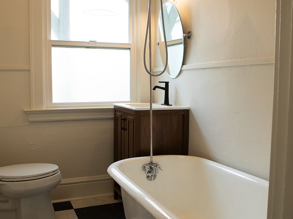 Bathroom (new floor, vanity, refinished tub)