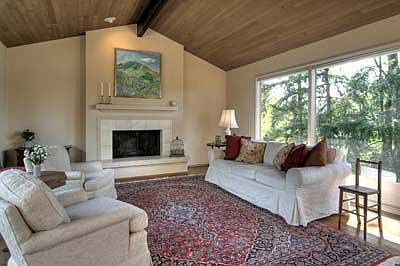 Large formal living room connects to the dining room and view deck.