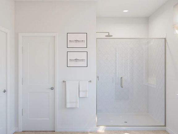 Primary bath with glass shower enclosure