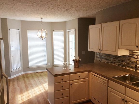 Sunny eat in kitchen with bay windows