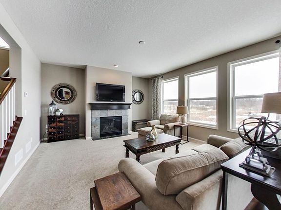 The main floor family room is flooded with natural light and offers views of the wetlands.