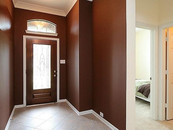 Foyer: Custom paint, high ceilings, crown moulding