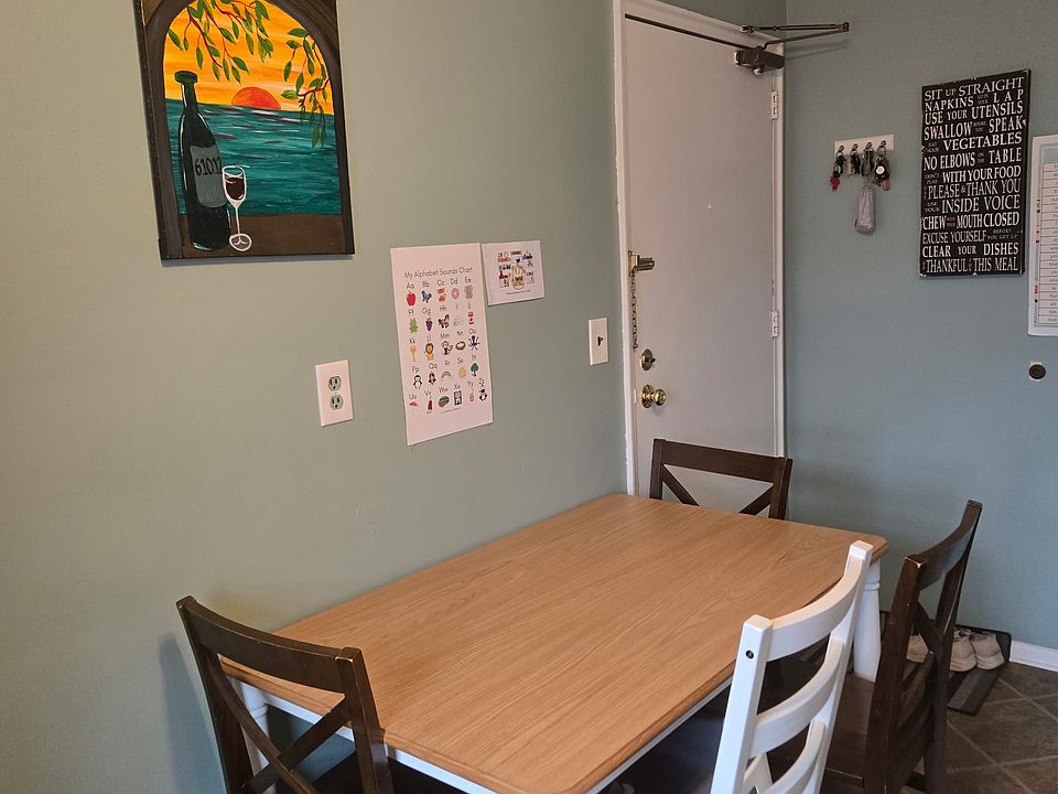 Eat-in Kitchen, Rear door access to parking and laundry