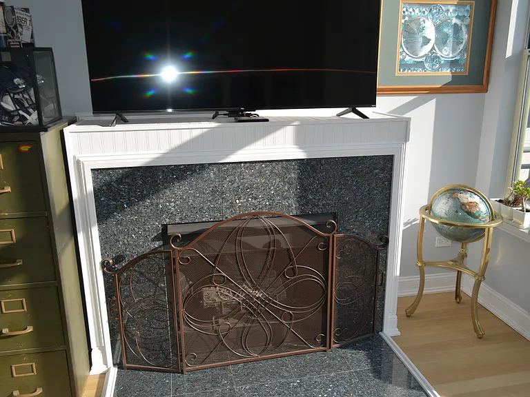 Gas fireplace and TV on the mantle adds ambiance anytime of the year. Radiant heating around the perimeter of the exterior floors keep it cozy too!
