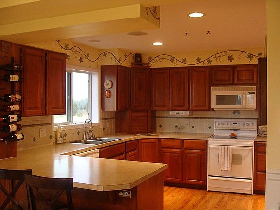 cherry wood cabinets-appliances stay