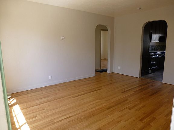 Living room, looking to kitchen and hall