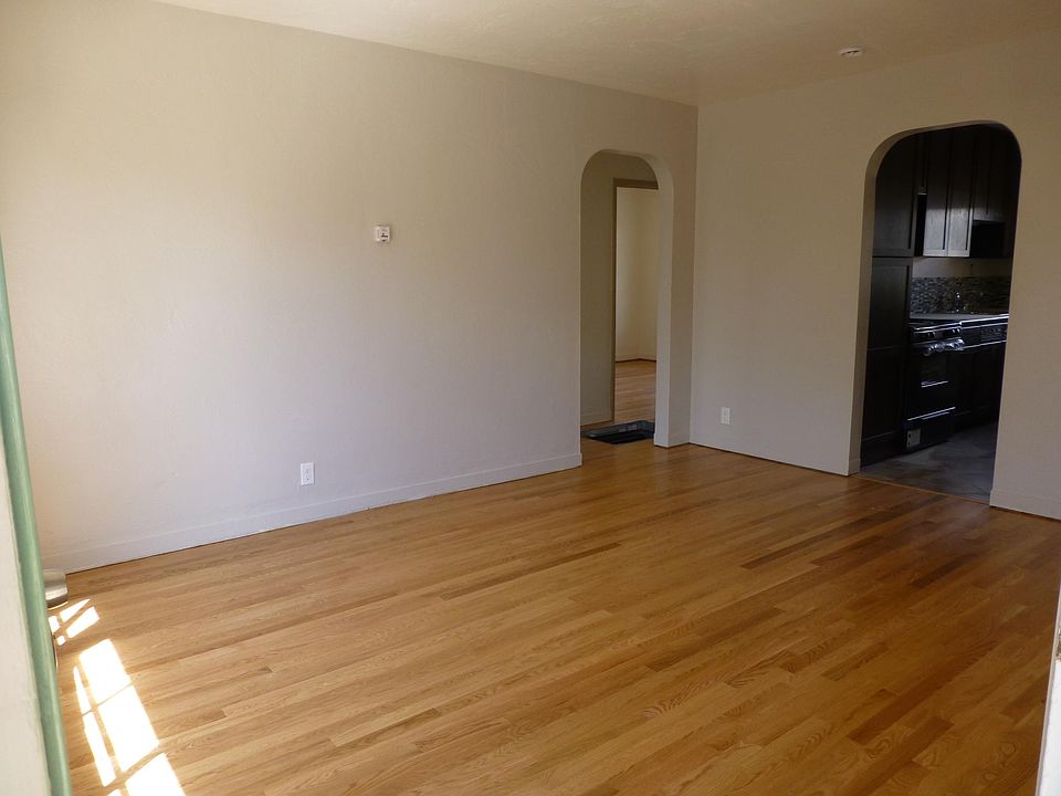 Living room, looking to kitchen and hall