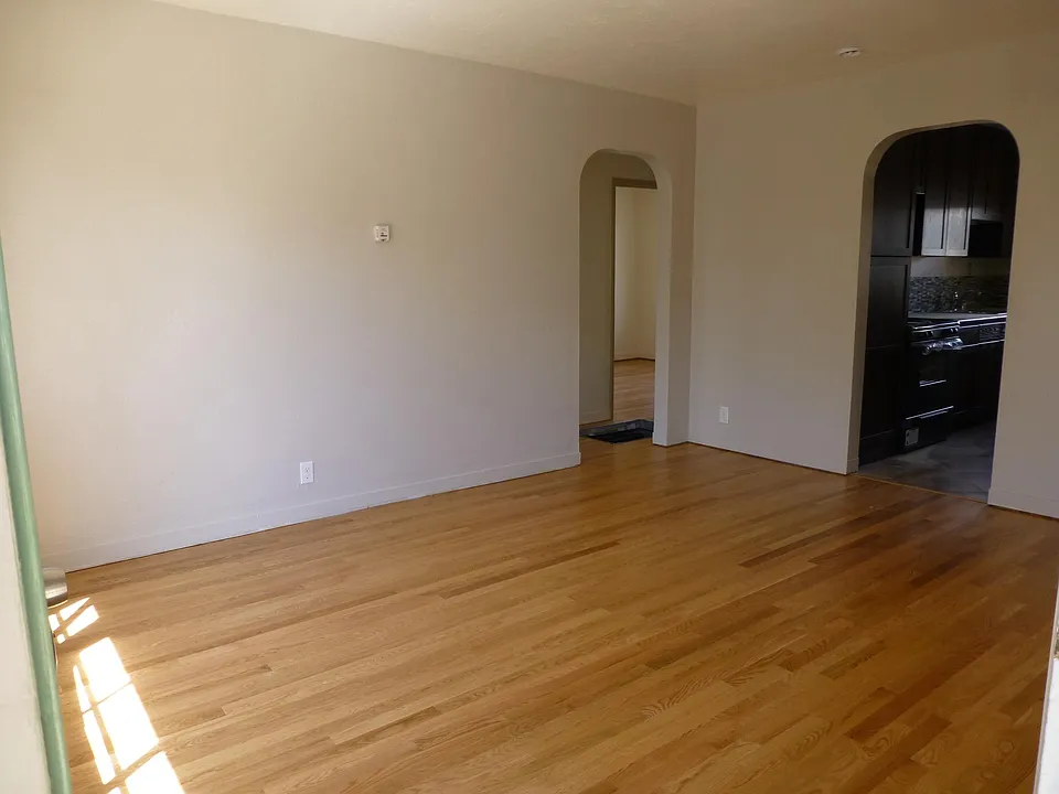 Living room, looking to kitchen and hall