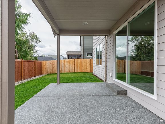 Photo is of the Model Home on Lot 1, the 2535 Sierra plan.  May depict enhancements and / or upgrades that are not available with every plan.>