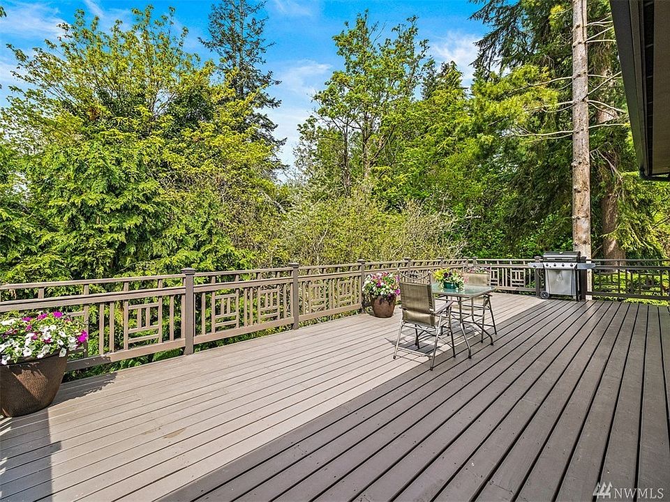 Get ready to have the family and friends over! The Expansive Deck runs from the living room all the way to the kitchen and is visible thru the westerly Wall of Windows throughout.