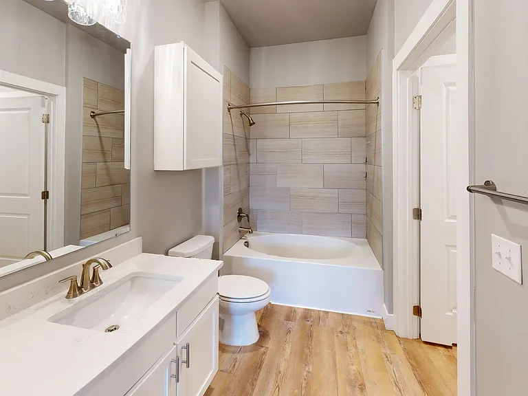 Sling Station's second bathroom can be entered from the common area or the second bedroom, and features a double sink and large oval bathtub. Sling Station's second bathroom can be entered from the common area or the second bedroom, and features a double 