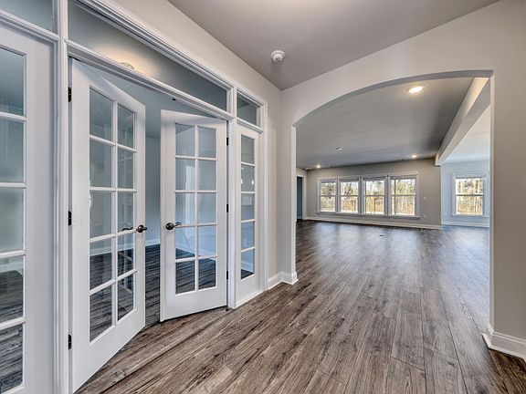 Inviting Foyer Space that showcases the beautiful archway into the Gathering Room and Kitchen.