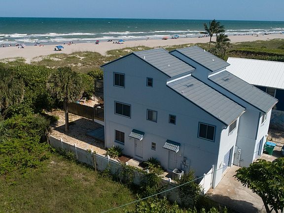 Private backyard with 1 car garage.