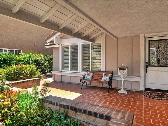 Covered front courtyard patio with room for outdoor furniture